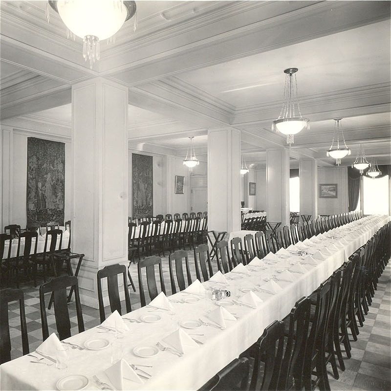 Dining hall with long tables and elegant decor