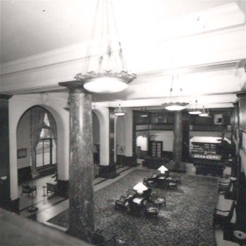 Elegant hotel lobby with marble columns and vintage furnishings