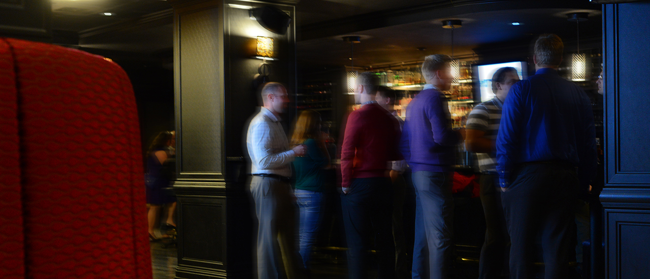 People mingling at Riverboat Lounge bar top